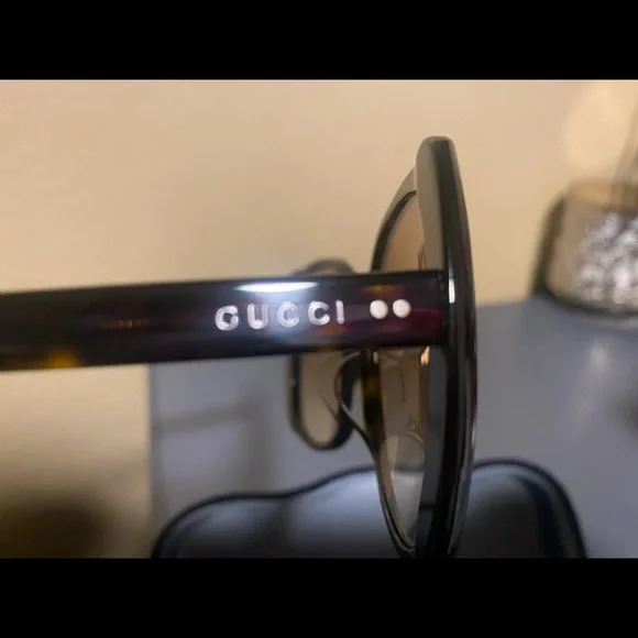 Authentic Brand new with no tags Gucci Sunglasses, brown. With sunglass case